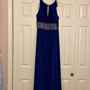 R & M Richards royal blue gown with open back.